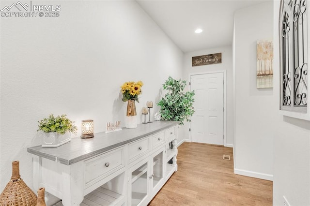 10140 Seawolf Dr, Colorado Springs, CO 80925 - entryway featuring light wood-type flooring, baseboards, and recessed lighting