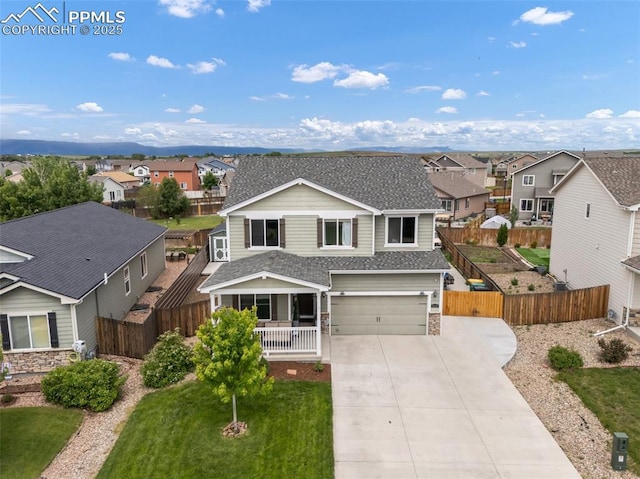 10140 Seawolf Dr, Colorado Springs, CO 80925 - traditional-style home featuring a residential view, roof with shingles, concrete driveway, covered porch, and a garage