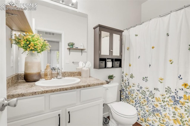 10140 Seawolf Dr, Colorado Springs, CO 80925 - full bathroom featuring vanity, toilet, and a shower with curtain