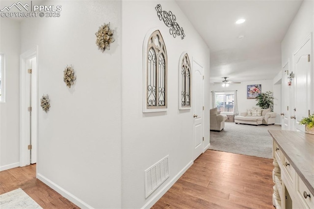 10140 Seawolf Dr, Colorado Springs, CO 80925 - hallway with light wood-type flooring, baseboards, and recessed lighting