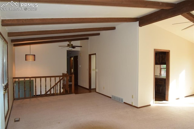 spare room featuring a ceiling fan, carpet, plenty of natural light, and baseboards