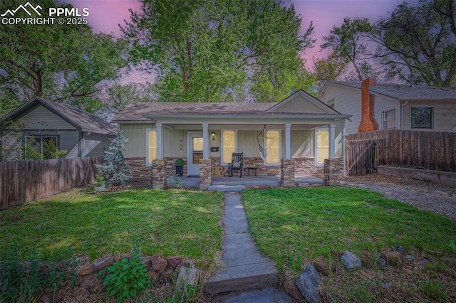 738 E Cache La Poudre St, Colorado Springs, CO 80903 - bungalow-style home with stone siding and covered porch