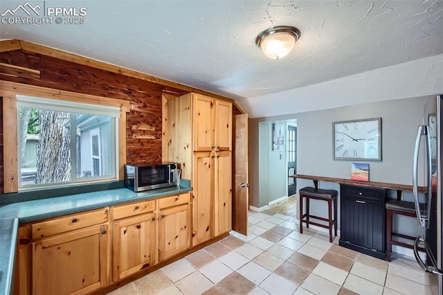 738 E Cache La Poudre St, Colorado Springs, CO 80903 - kitchen featuring appliances with stainless steel finishes, baseboards, light brown cabinetry, light tile patterned floors, and an office area