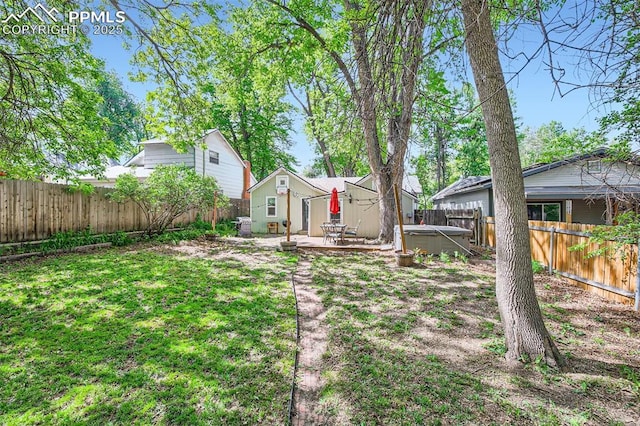 738 E Cache La Poudre St, Colorado Springs, CO 80903 - fenced backyard with a hot tub and a patio