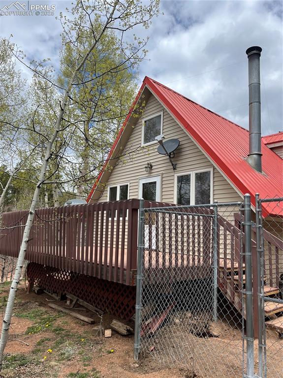 646 Grey Eagle Dr, Cripple Creek, CO 80813 - rear view of house featuring a deck and metal roof