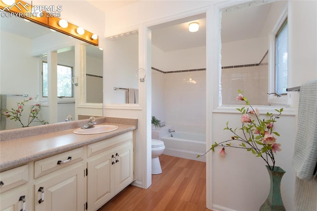 6331 Mesedge Dr, Colorado Springs, CO 80919 - full bath featuring toilet, wood finished floors, vanity, and healthy amount of natural light