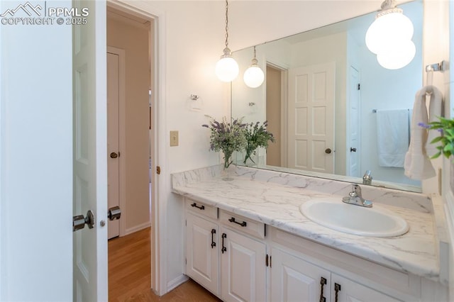 6331 Mesedge Dr, Colorado Springs, CO 80919 - bathroom featuring vanity and wood finished floors