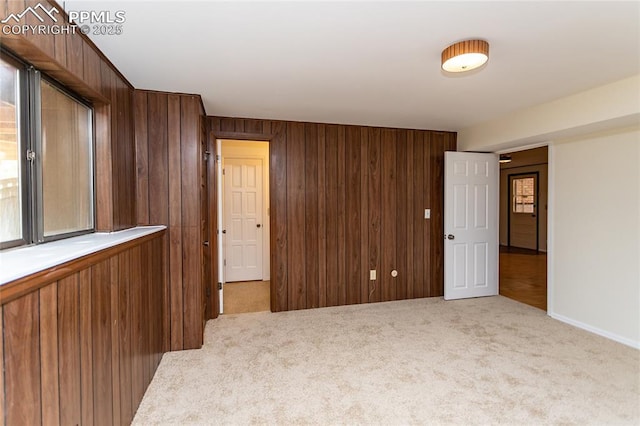 6331 Mesedge Dr, Colorado Springs, CO 80919 - carpeted spare room featuring wooden walls and baseboards