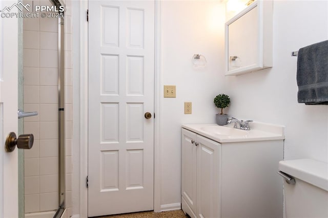 6331 Mesedge Dr, Colorado Springs, CO 80919 - bathroom featuring tiled shower, toilet, and vanity