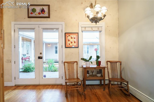 15 Cypress Ln, Colorado Springs, CO 80906 - doorway featuring french doors, wood finished floors, and a chandelier