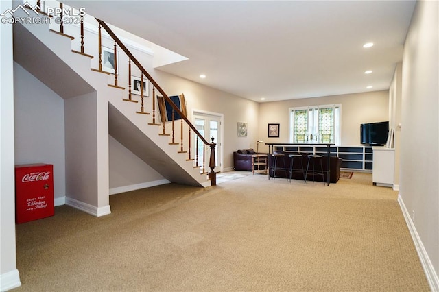 15 Cypress Ln, Colorado Springs, CO 80906 - living room featuring light colored carpet, stairs, recessed lighting, and baseboards
