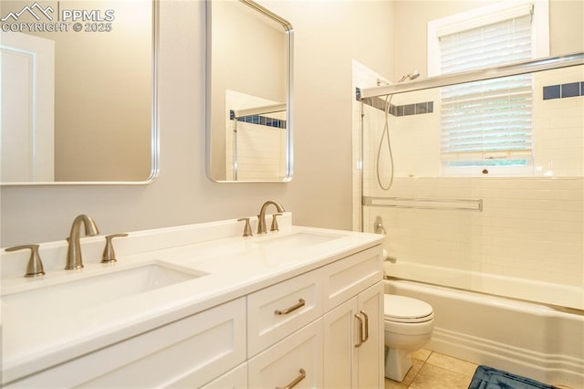 15 Cypress Ln, Colorado Springs, CO 80906 - full bathroom featuring toilet, double vanity, enclosed tub / shower combo, and tile patterned floors