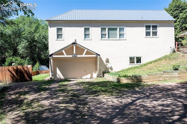 15 Cypress Ln, Colorado Springs, CO 80906 - view of front of home featuring stucco siding, metal roof, and an attached garage