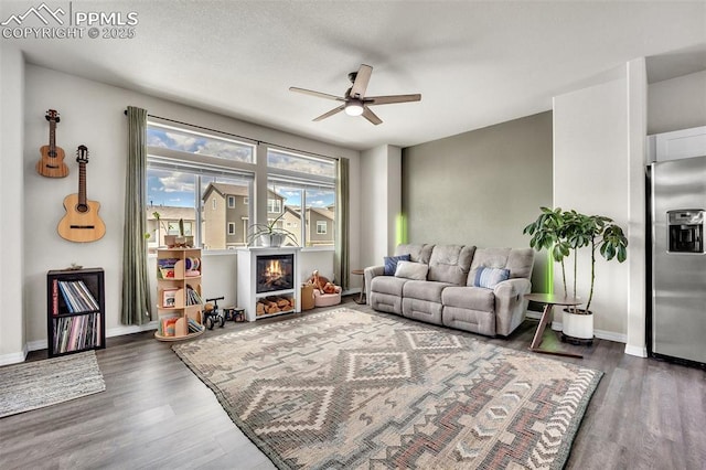 793 Grissom Dr, Colorado Springs, CO 80915 - living room with a ceiling fan, wood finished floors, and baseboards