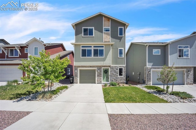 793 Grissom Dr, Colorado Springs, CO 80915 - view of front of house with stone siding, an attached garage, driveway, and a front yard
