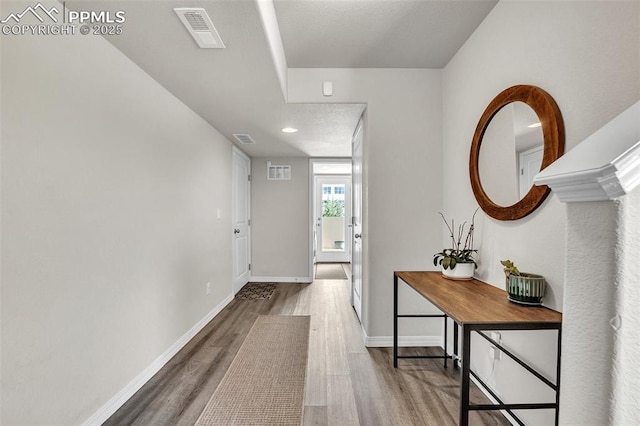 793 Grissom Dr, Colorado Springs, CO 80915 - hallway featuring wood finished floors, baseboards, and recessed lighting