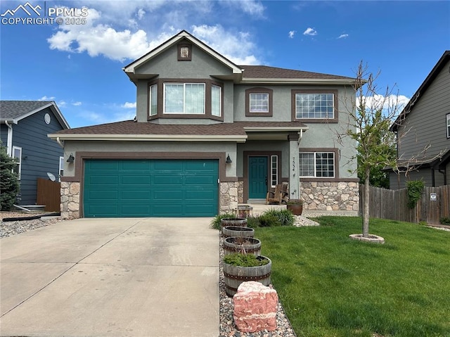 7534 Sistine Ln, Fountain, CO 80817 - view of front of house featuring stucco siding, stone siding, and concrete driveway