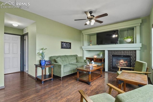 7534 Sistine Ln, Fountain, CO 80817 - living area with ceiling fan, a high end fireplace, and wood finished floors