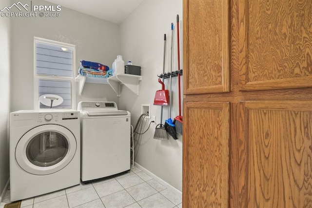 7534 Sistine Ln, Fountain, CO 80817 - washroom with washing machine and clothes dryer, light tile patterned floors, and baseboards