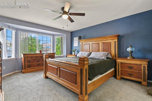 7534 Sistine Ln, Fountain, CO 80817 - bedroom featuring light colored carpet, a ceiling fan, and baseboards