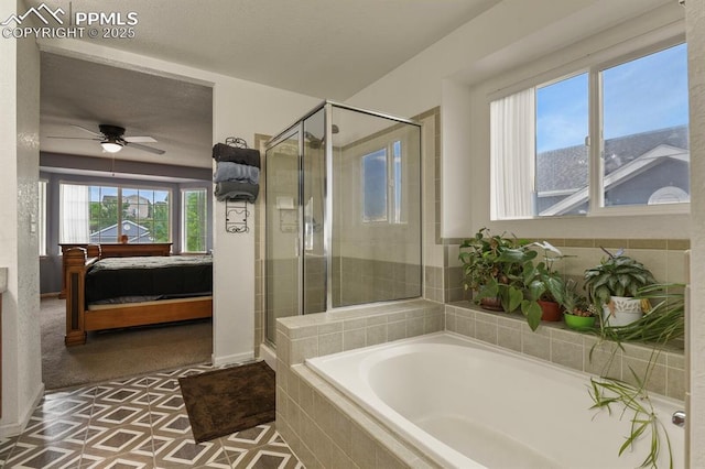 7534 Sistine Ln, Fountain, CO 80817 - ensuite bathroom with a stall shower, a garden tub, and a ceiling fan