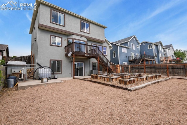 7534 Sistine Ln, Fountain, CO 80817 - rear view of property with stairway, a deck, a residential view, stucco siding, and a patio