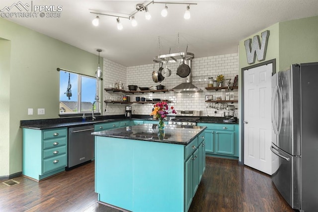 7534 Sistine Ln, Fountain, CO 80817 - kitchen with appliances with stainless steel finishes, open shelves, dark countertops, and dark wood-style floors