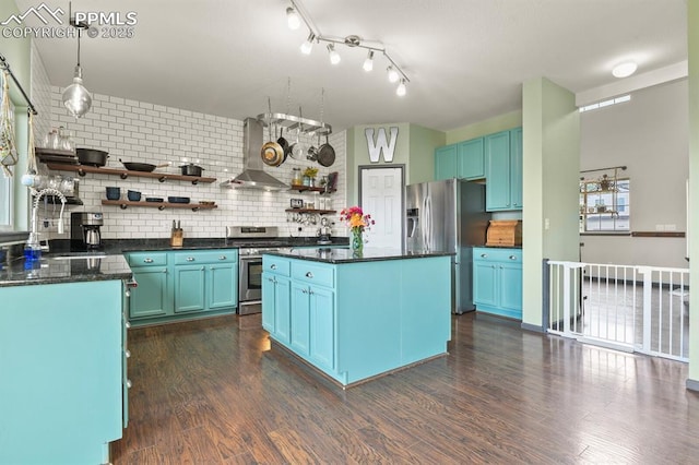 7534 Sistine Ln, Fountain, CO 80817 - kitchen featuring wall chimney exhaust hood, open shelves, appliances with stainless steel finishes, and dark countertops