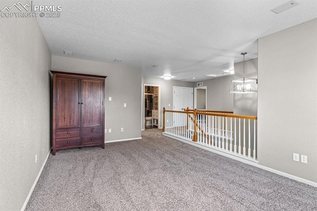8020 Firecracker Trl, Fountain, CO 80817 - carpeted empty room featuring baseboards and a textured ceiling