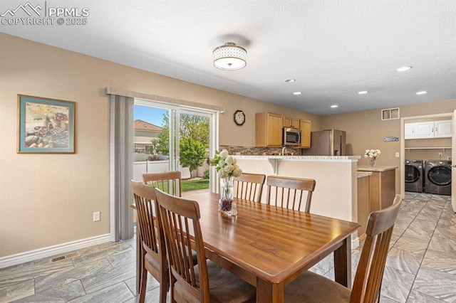 8020 Firecracker Trl, Fountain, CO 80817 - dining room featuring separate washer and dryer, baseboards, and recessed lighting