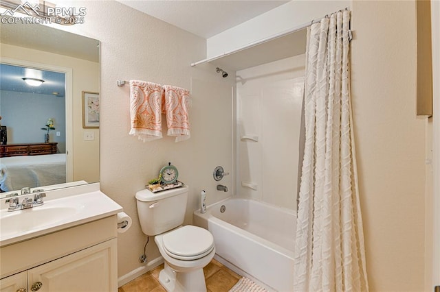 6463 Binder Dr, Colorado Springs, CO 80923 - ensuite bathroom with toilet, shower / bath combo, vanity, tile patterned flooring, and a textured wall