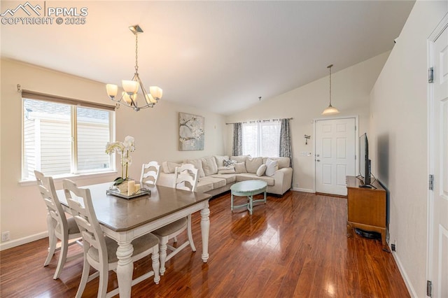 6463 Binder Dr, Colorado Springs, CO 80923 - dining area featuring a chandelier, vaulted ceiling, dark wood finished floors, and baseboards