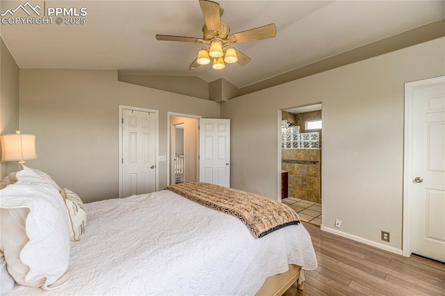 6463 Binder Dr, Colorado Springs, CO 80923 - bedroom featuring wood finished floors, baseboards, lofted ceiling, connected bathroom, and ceiling fan