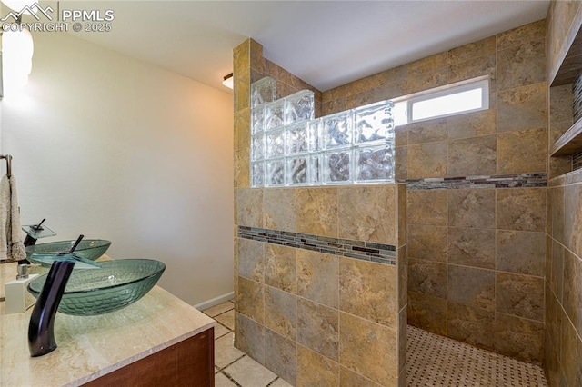 6463 Binder Dr, Colorado Springs, CO 80923 - full bath with a walk in shower, tile patterned floors, and baseboards