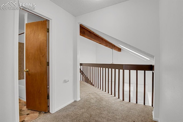 3300 W Florida Ave Unit 26, Denver, CO 80219 - hall featuring carpet floors, baseboards, and a textured ceiling