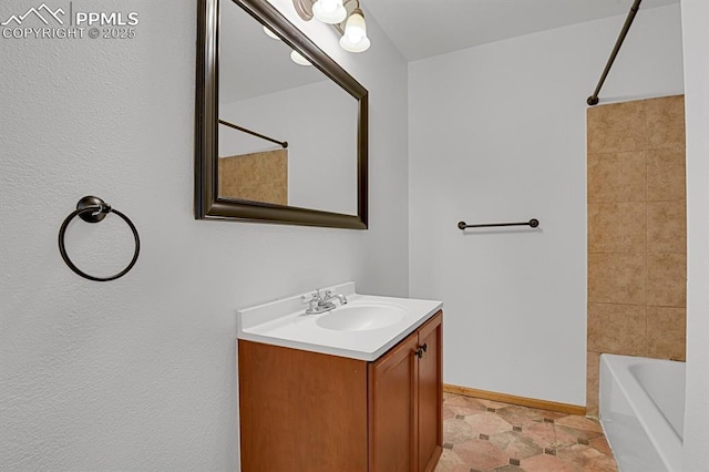 3300 W Florida Ave Unit 26, Denver, CO 80219 - bathroom with vanity, shower / bathtub combination, and baseboards