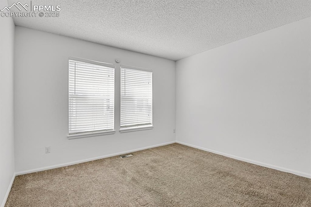 3300 W Florida Ave Unit 26, Denver, CO 80219 - spare room featuring carpet, a textured ceiling, and baseboards