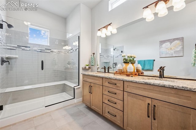 2267 Merlot Dr, Colorado Springs, CO 80921 - bathroom featuring double vanity, a stall shower, and tile patterned floors