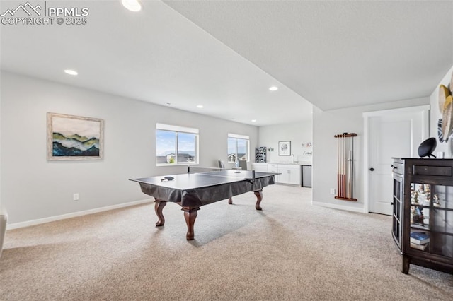 2267 Merlot Dr, Colorado Springs, CO 80921 - recreation room featuring light carpet, baseboards, and recessed lighting