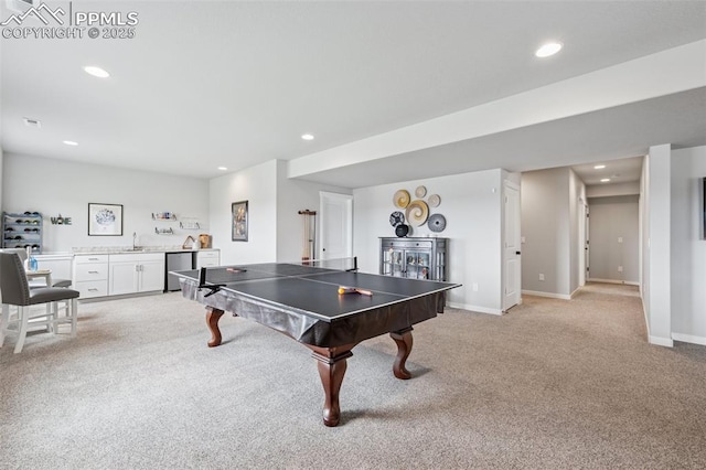 2267 Merlot Dr, Colorado Springs, CO 80921 - game room with light carpet, bar with sink, recessed lighting, and baseboards