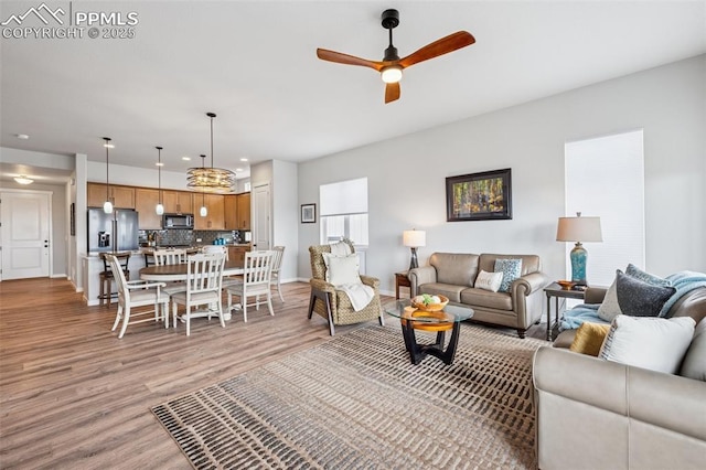 2267 Merlot Dr, Colorado Springs, CO 80921 - living room featuring light wood-style flooring, ceiling fan, baseboards, and recessed lighting