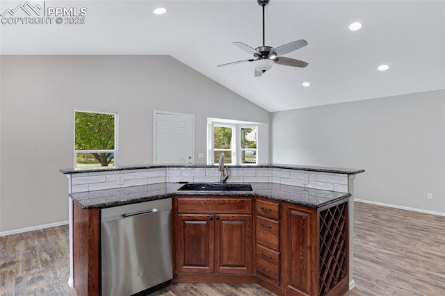 4465 Archwood Dr, Colorado Springs, CO 80920 - kitchen with dishwasher, a sink, ceiling fan, a center island with sink, and lofted ceiling