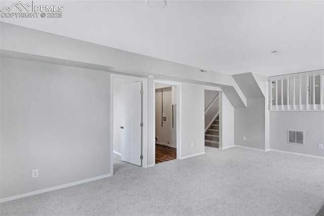 4465 Archwood Dr, Colorado Springs, CO 80920 - finished basement with carpet floors, stairs, and baseboards