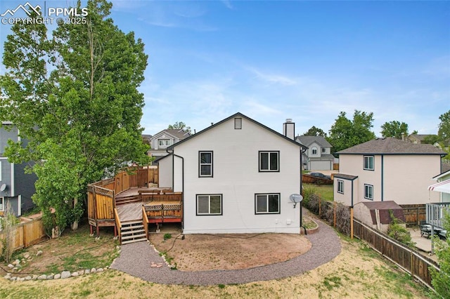 4465 Archwood Dr, Colorado Springs, CO 80920 - rear view of house featuring a fenced backyard and a wooden deck