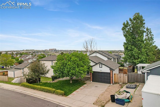 4465 Archwood Dr, Colorado Springs, CO 80920 - view of front of home with a residential view, a garage, concrete driveway, and brick siding