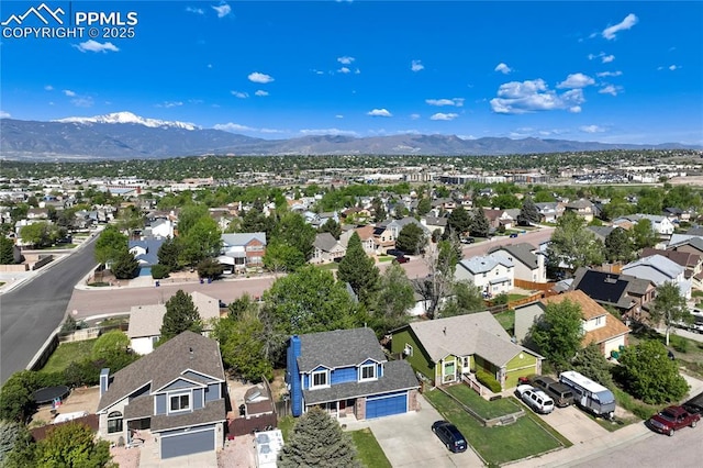 2620 Warrenton Way, Colorado Springs, CO 80922 - aerial perspective of suburban area featuring a mountainous background