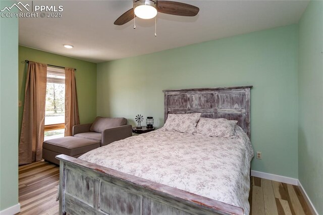 7815 Mallard Dr, Peyton, CO 80831 - bedroom with wood finished floors, baseboards, and ceiling fan