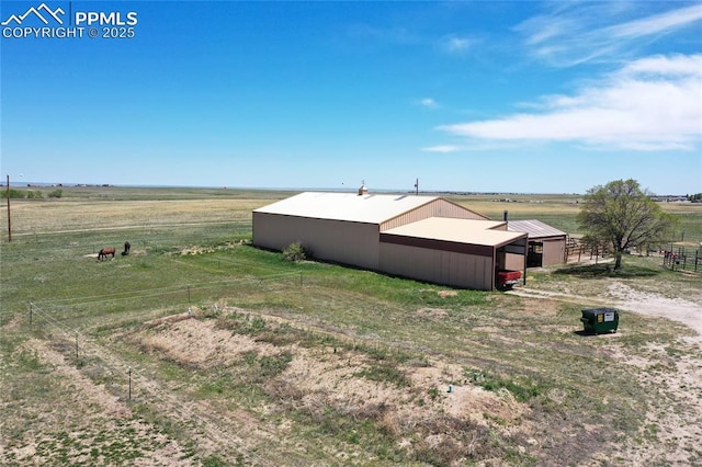 7815 Mallard Dr, Peyton, CO 80831 - view of yard featuring an outbuilding, a view of countryside, and an outdoor structure