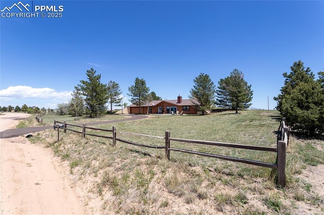 7815 Mallard Dr, Peyton, CO 80831 - single story home featuring a rural view, driveway, and a garage