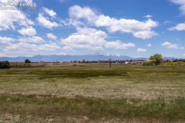7815 Mallard Dr, Peyton, CO 80831 - view of green lawn with a mountain view and a view of rural / pastoral area